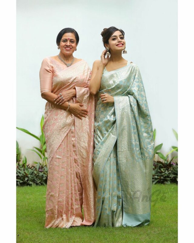 mother and daughter wearing sarees
